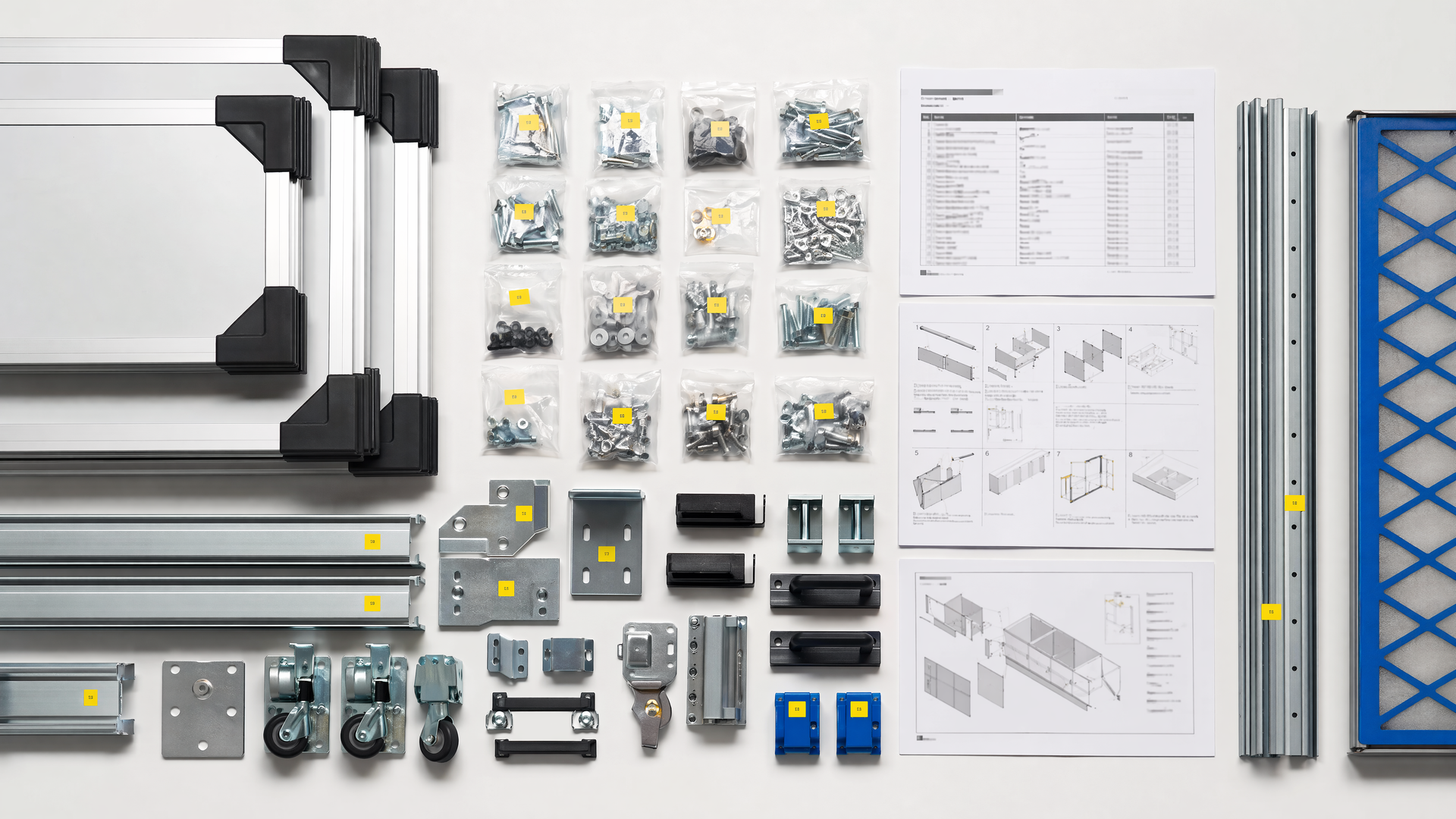 Representative modular kit hardware and assembly documentation arranged for handoff